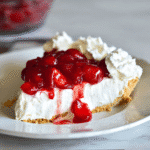 Slice of cheesecake recipe no bake Cool Whip with cherry topping